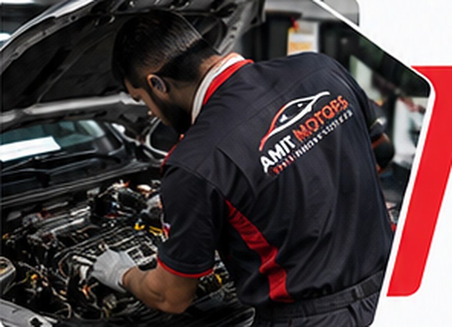 Amit Motors mechanic working on a car engine
